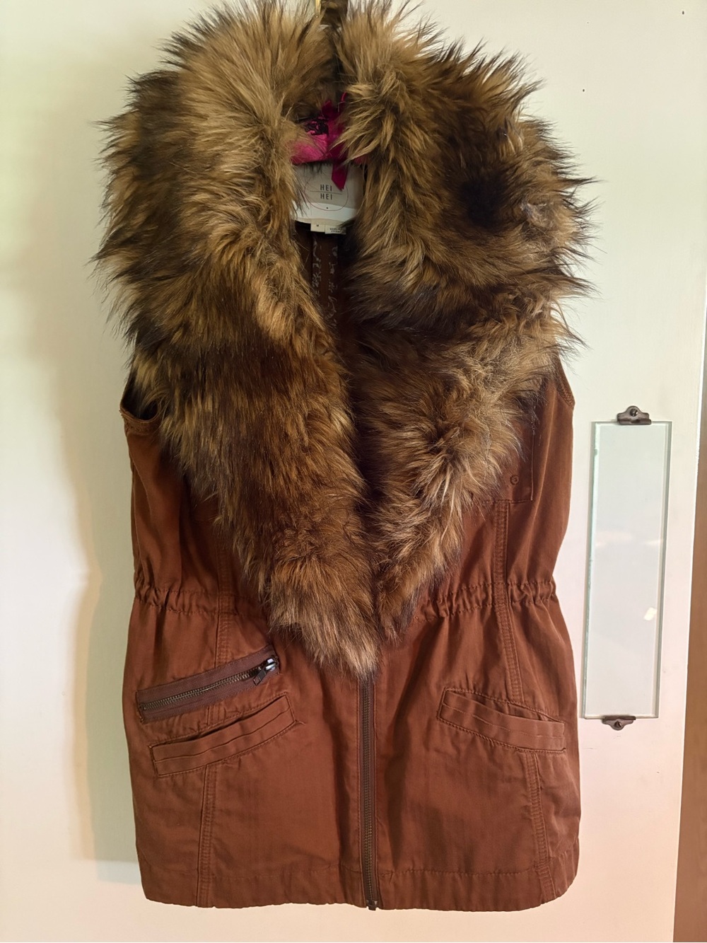 Hip length fur collared vest